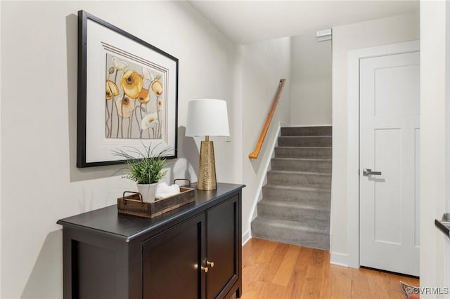 stairway featuring wood finished floors