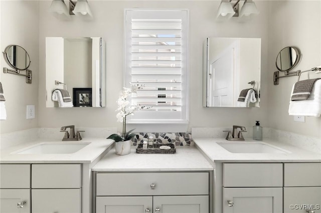 full bathroom featuring two vanities and a sink