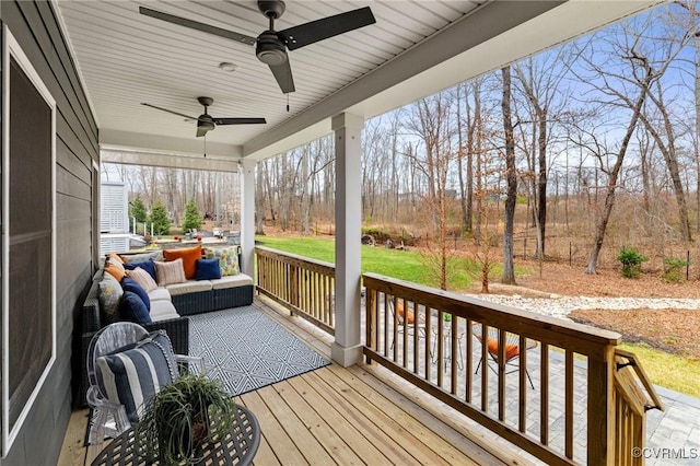 deck featuring an outdoor hangout area and ceiling fan