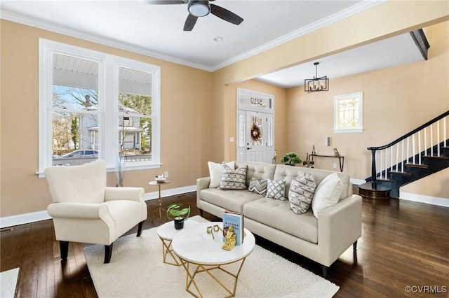 living area featuring dark wood-style floors, baseboards, and stairs