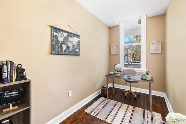 office space with baseboards and wood finished floors