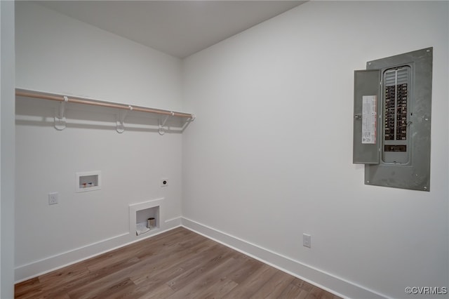 laundry area with washer hookup, hookup for an electric dryer, wood finished floors, laundry area, and electric panel