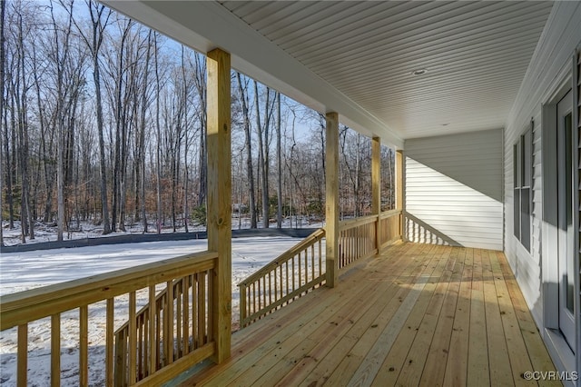 view of snow covered deck