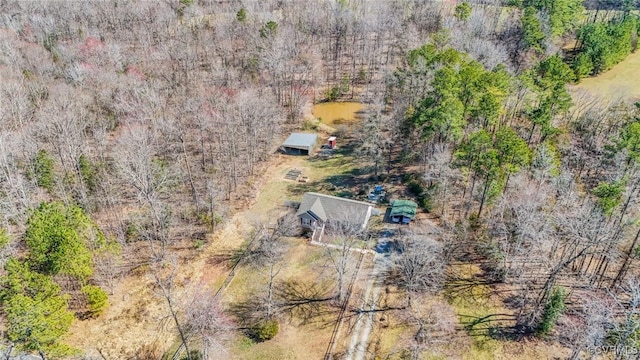 bird's eye view featuring a wooded view