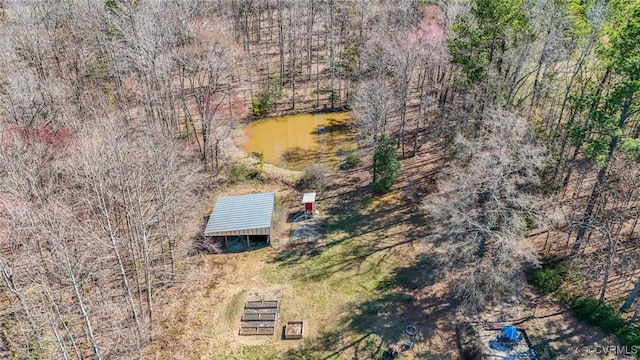 drone / aerial view featuring a forest view