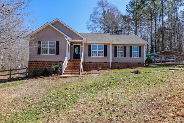 single story home with crawl space, a carport, a front yard, and fence