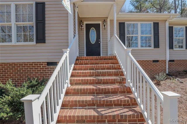 view of exterior entry with crawl space