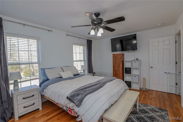 bedroom featuring light wood finished floors and ceiling fan