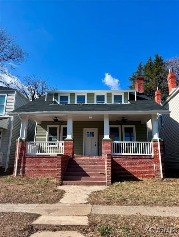 bungalow-style house featuring covered porch and ceiling fan