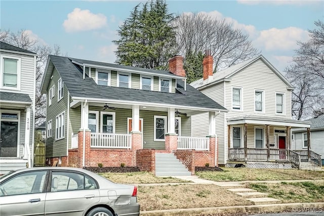 view of front of house with covered porch and a chimney