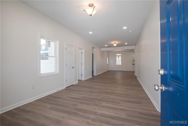 foyer entrance with recessed lighting, wood finished floors, and baseboards