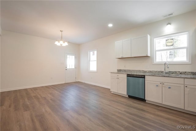 kitchen featuring a wealth of natural light, baseboards, visible vents, and dishwasher