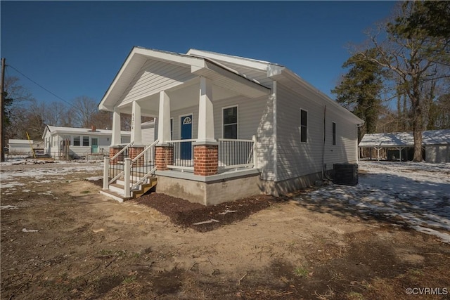 view of front of property featuring central AC and a porch