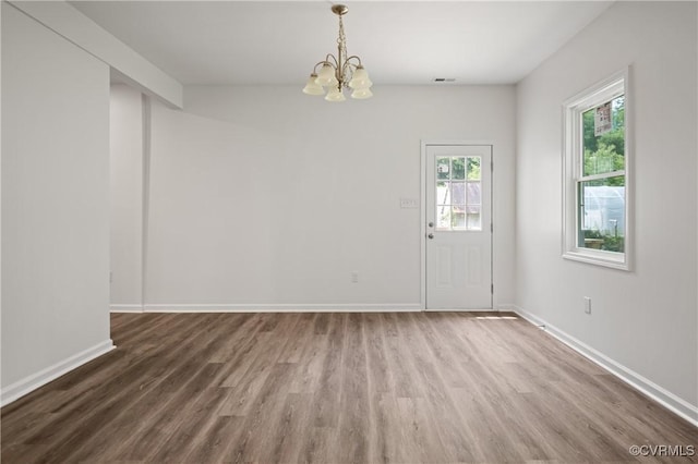 9214 River Rd, Chesterfield, VA 23803 - unfurnished dining area featuring wood finished floors, a chandelier, and healthy amount of natural light
