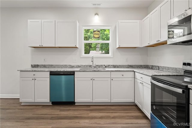 9214 River Rd, Chesterfield, VA 23803 - kitchen with appliances with stainless steel finishes, white cabinetry, and dark wood finished floors