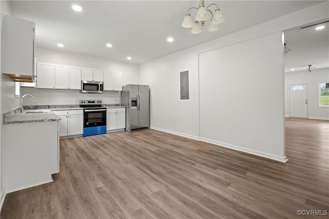 9214 River Rd, Chesterfield, VA 23803 - kitchen featuring stainless steel appliances, recessed lighting, electric panel, light wood-type flooring, and a chandelier