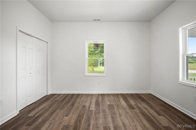 9214 River Rd, Chesterfield, VA 23803 - unfurnished bedroom with dark wood-style floors and a closet