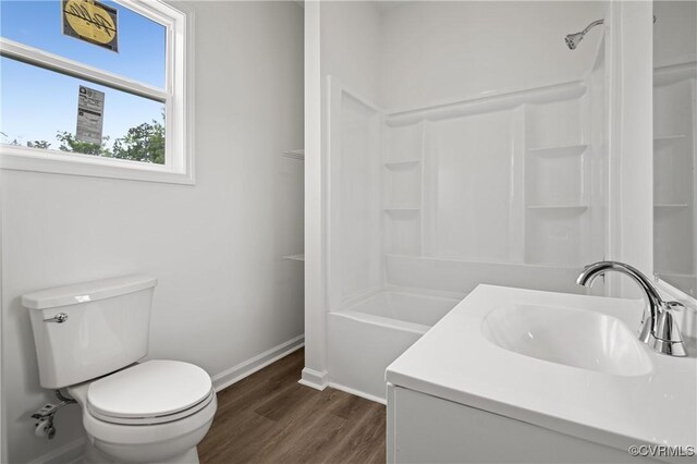 9214 River Rd, Chesterfield, VA 23803 - full bath featuring vanity, wood finished floors, and  shower combination