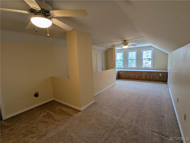 bonus room with baseboards, a ceiling fan, carpet flooring, and vaulted ceiling