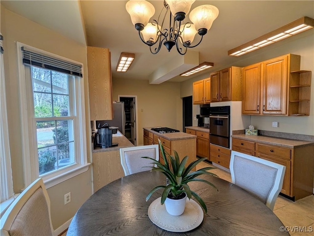 dining space featuring a notable chandelier