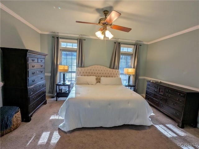 carpeted bedroom with ceiling fan, multiple windows, and ornamental molding