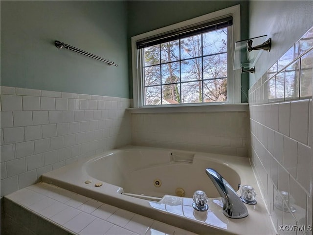 bathroom featuring a tub with jets