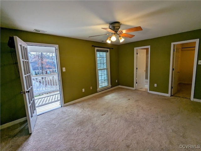 unfurnished bedroom featuring visible vents, baseboards, access to exterior, and carpet flooring