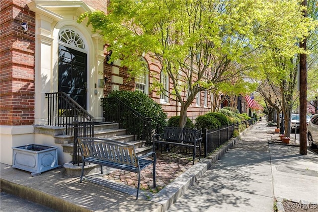 doorway to property with brick siding