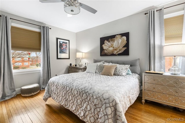 bedroom featuring hardwood / wood-style flooring and a ceiling fan