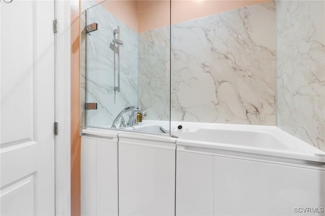 full bathroom featuring a sink, a marble finish shower, and a bath