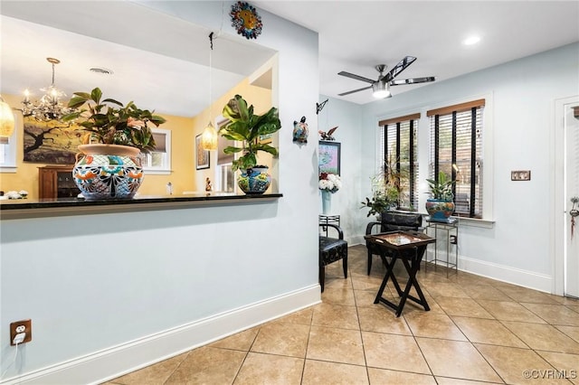 interior space featuring ceiling fan and visible vents