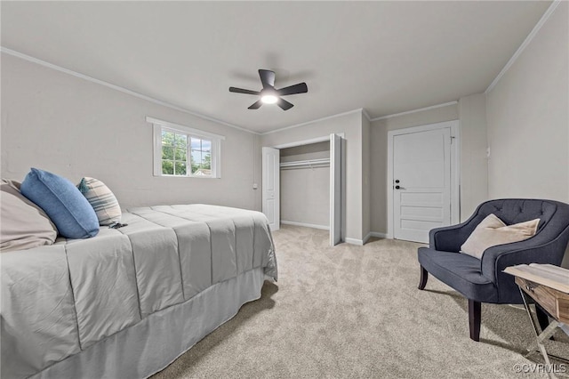 bedroom with a closet, light colored carpet, ornamental molding, ceiling fan, and baseboards