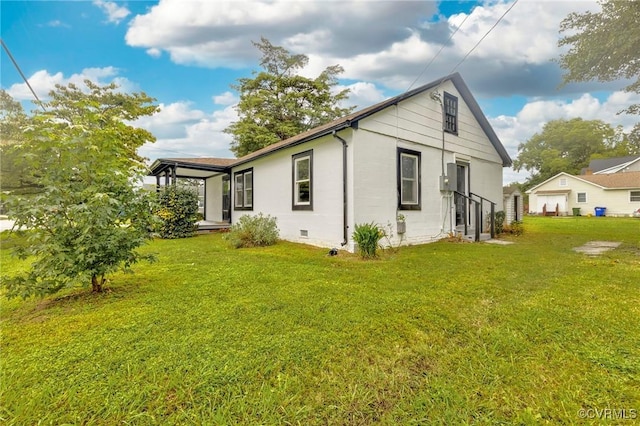 view of home's exterior featuring a yard and crawl space