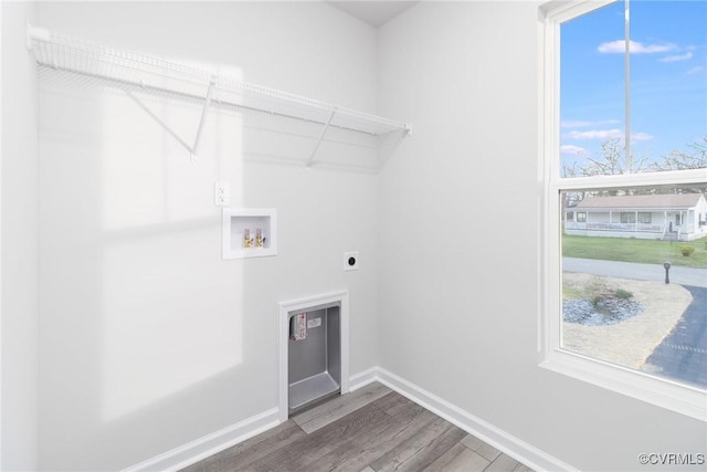 washroom featuring laundry area, hookup for a washing machine, a wealth of natural light, and hookup for an electric dryer