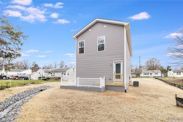 view of home's exterior with a residential view and central AC