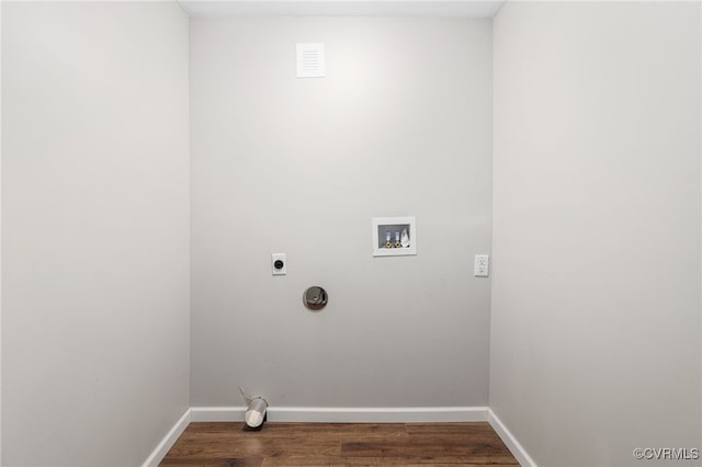 laundry area with hookup for a washing machine, electric dryer hookup, wood finished floors, laundry area, and baseboards