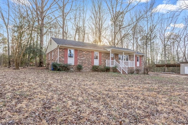 ranch-style house with brick siding