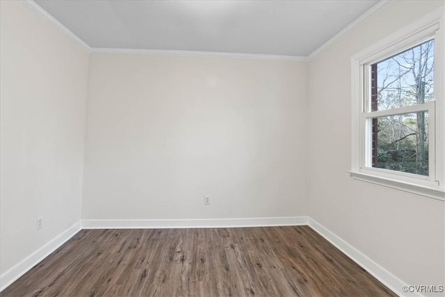 empty room with crown molding, dark wood-style flooring, and baseboards