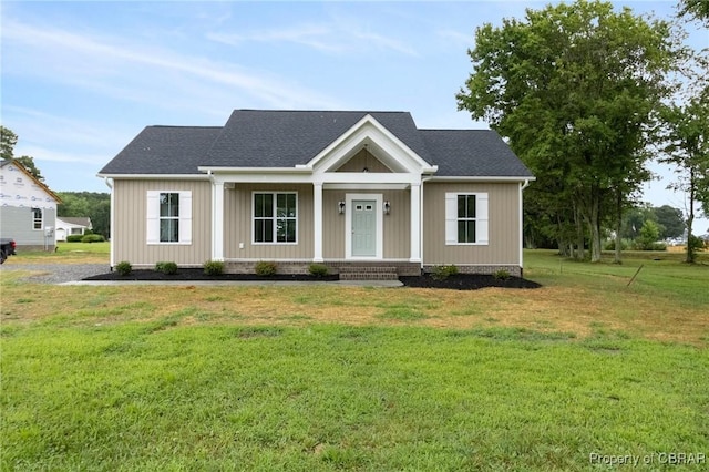 100 Bowsprit Ln, Wicomico Church, VA 22473 - view of front of property with covered porch, a front lawn, and a shingled roof