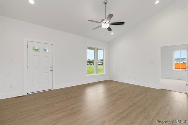 100 Bowsprit Ln, Wicomico Church, VA 22473 - unfurnished living room with plenty of natural light, wood finished floors, a ceiling fan, recessed lighting, and high vaulted ceiling