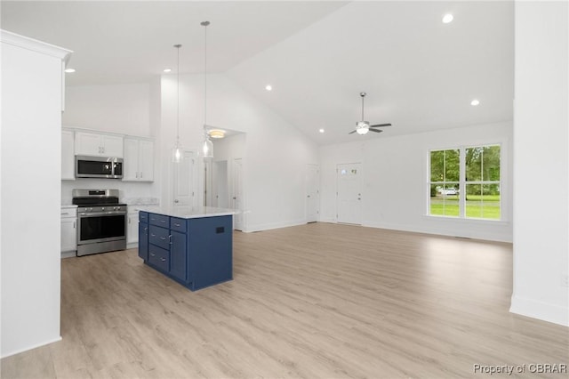 100 Bowsprit Ln, Wicomico Church, VA 22473 - kitchen with appliances with stainless steel finishes, high vaulted ceiling, blue cabinetry, white cabinets, and ceiling fan