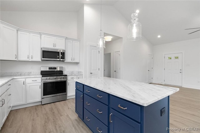 100 Bowsprit Ln, Wicomico Church, VA 22473 - kitchen with appliances with stainless steel finishes, high vaulted ceiling, blue cabinetry, white cabinetry, and a center island
