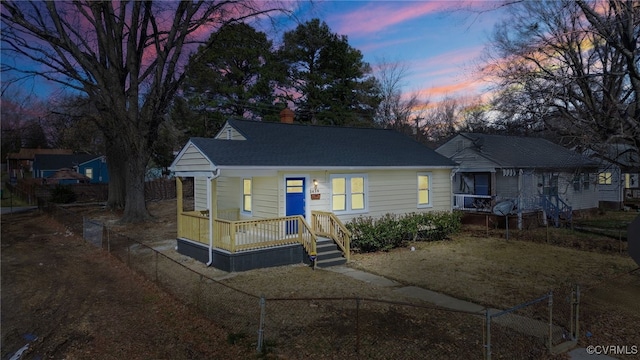 view of front of home featuring fence