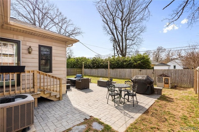 view of patio with central AC, grilling area, a fenced backyard, and an outdoor living space