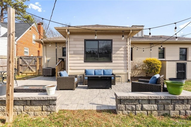 rear view of house with an outdoor hangout area, a patio, fence, and central air condition unit