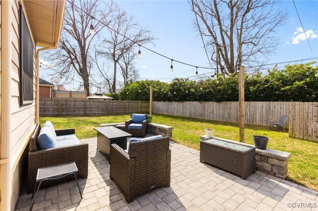 view of patio featuring outdoor lounge area and a fenced backyard