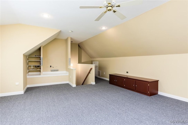 bonus room with lofted ceiling, baseboards, carpet flooring, and built in features