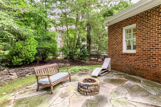 view of patio / terrace featuring an outdoor fire pit