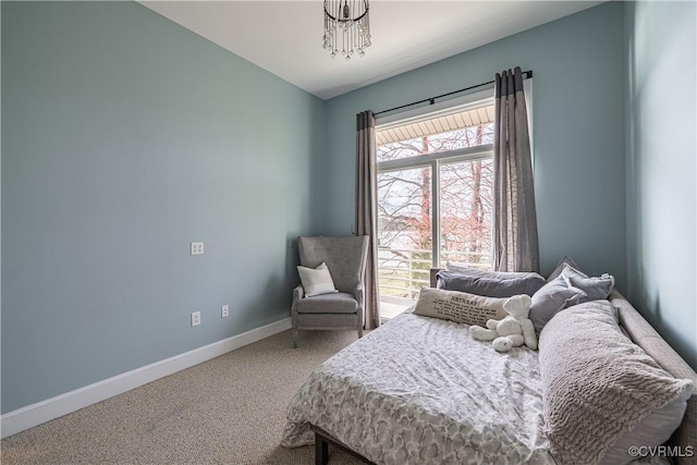 bedroom featuring carpet flooring and baseboards