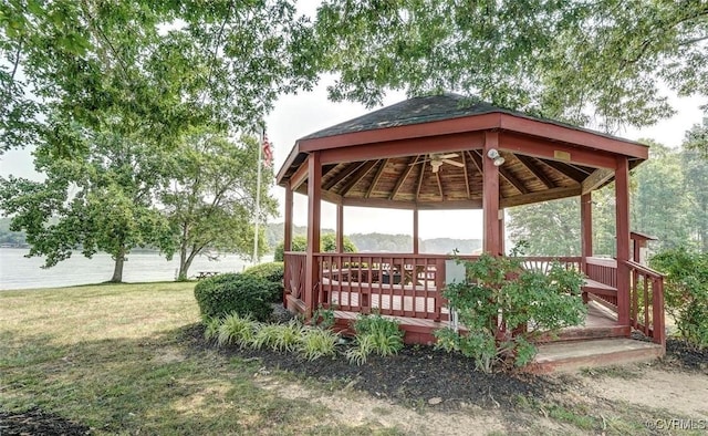 surrounding community with a gazebo and a yard